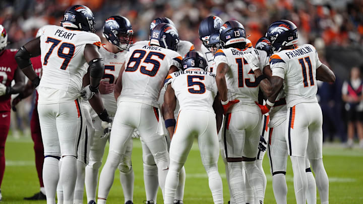 Aug 16, 2025; Denver, Colorado, USA; Members of the Denver Broncos offensive squad huddles in the second quarter against the Arizona Cardinals at Empower Field at Mile High. Aug 16, 2025; Denver, Colorado, USA; Members of the Denver Broncos offensive squad huddles in the second quarter against the Arizona Cardinals at Empower Field at Mile High.