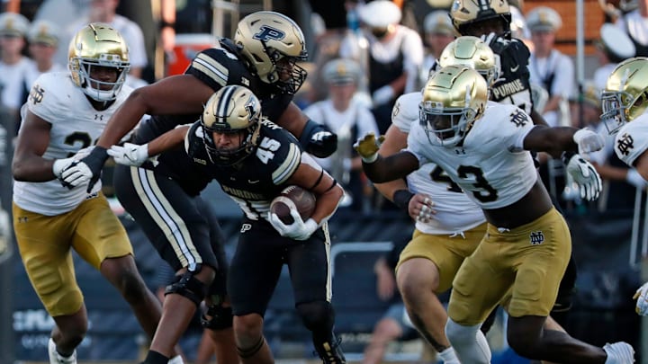 Purdue Boilermakers running back Devin Mockobee (45) rushes the ball 