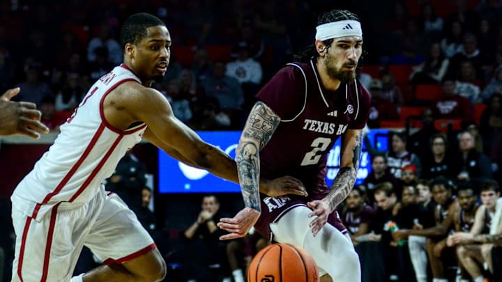 Texas A&M guard Pop Isaacs passes against Oklahoma.
