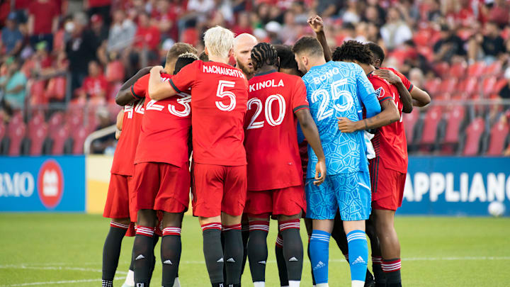 Toronto FC players huddle before the MLS game between...