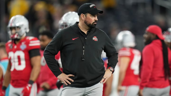 Dec 29, 2023; Arlington, Texas, USA; Ohio State Buckeyes head coach Ryan Day leads warm-ups prior to the Goodyear Cotton Bowl Classic against the Missouri Tigers at AT&T Stadium.