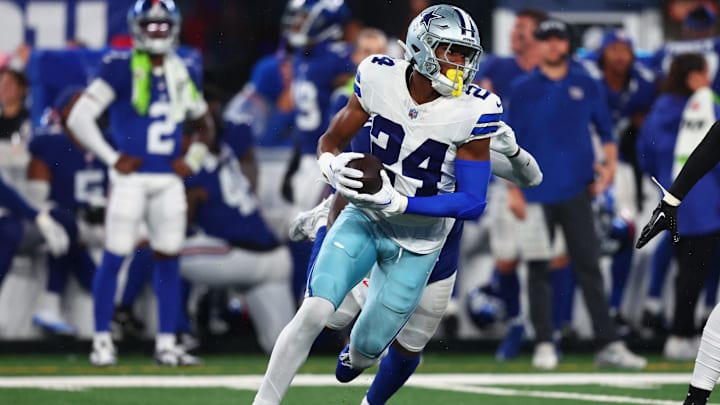 Dallas Cowboys safety Israel Mukuamu returns a fumble recovery for a touchdown against the New York Giants.