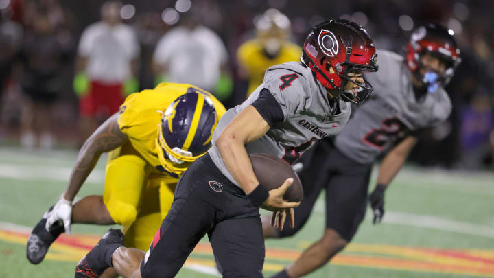 Husan Longstreet of Corona Centennial scrambles against Hawaii Punahou on Sept. 2, 2023. Husan Longstreet of Corona Centennial scrambles against Hawaii Punahou on Sept. 2, 2023.