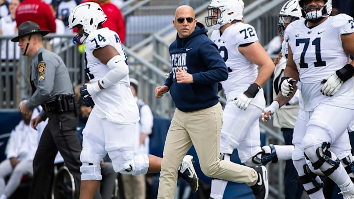 Penn State coach James Franklin leads the Nittany Lions onto the field at the start of the Blue-White Game at Beaver Stadium. 