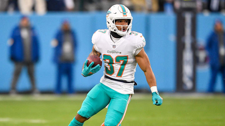  Miami Dolphins running back Myles Gaskin (37) runs the ball against the Tennessee Titans during the first half at Nissan Stadium in the 2021 season.