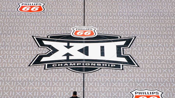 Mar 13, 2026; Kansas City, MO, USA; Big 12 logo center court after the LED floor was removed and a traditional wood floor was installed for the remaining tournament games prior to the game between the Iowa State Cyclones and the Arizona Wildcats at T-Mobile Center. Mandatory Credit: William Purnell-Imagn Images Mar 13, 2026; Kansas City, MO, USA; Big 12 logo center court after the LED floor was removed and a traditional wood floor was installed for the remaining tournament games prior to the game between the Iowa State Cyclones and the Arizona Wildcats at T-Mobile Center. Mandatory Credit: William Purnell-Imagn Images