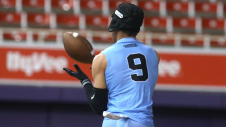 Arena Elite 15U’s Kasen Thomas (9) hauls in a pass during a 7-on-7 football tournament Saturday, April 13, 2024 at the UNI Dome in Cedar Falls, Iowa.