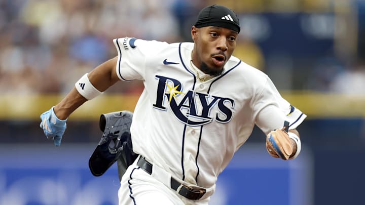 Apr 12, 2026; St. Petersburg, Florida, USA; Tampa Bay Rays left fielder Chandler Simpson (14) runs to third base against the New York Yankees in the first inning at Tropicana Field. 