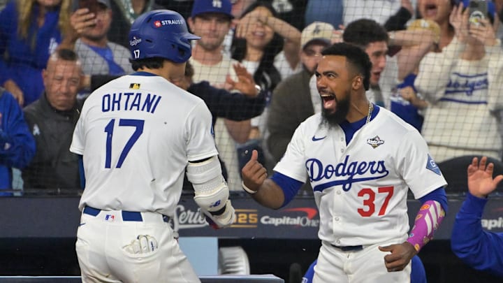 Oct 27, 2025; Los Angeles, California, USA; Los Angeles Dodgers two-way player Shohei Ohtani (17) celebrates with right fielder Teoscar Hernandez (37) after hitting a solo home run against the Toronto Blue Jays in the seventh inning during game three of the 2025 MLB World Series at Dodger Stadium. Mandatory Credit: Jayne Kamin-Oncea-Imagn Images