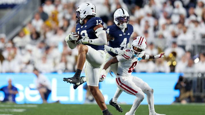 Penn State Nittany Lions linebacker Tony Rojas (13) intercepts a pass during the fourth quarter against the Wisconsin Badgers at Beaver Stadium. Penn State Nittany Lions linebacker Tony Rojas (13) intercepts a pass during the fourth quarter against the Wisconsin Badgers at Beaver Stadium.