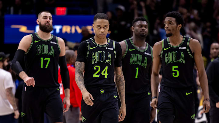 Feb 23, 2024; New Orleans, Louisiana, USA;  New Orleans Pelicans guard Jordan Hawkins (24) and center Jonas Valanciunas (17) and forward Herbert Jones (5) look on against the Miami Heat during the second half at Smoothie King Center. Mandatory Credit: Stephen Lew-Imagn Images
