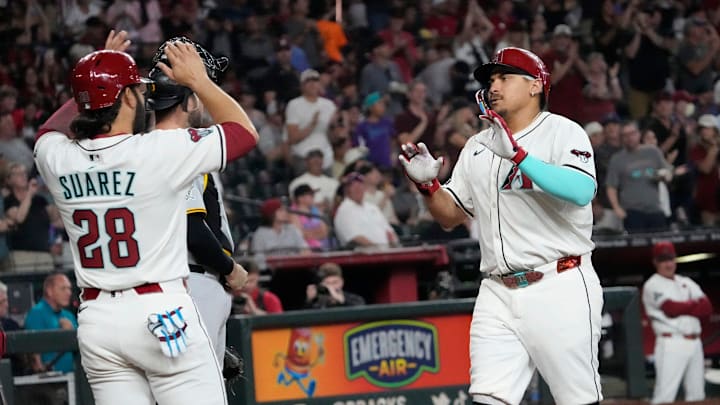 Arizona Diamondbacks’ Josh Naylor (22) is congratulated by Eugenio Suarez (28) after a two-run home run against the Pittsburgh Pirates during the fifth inning at Chase Field on May 26, 2025. Arizona Diamondbacks’ Josh Naylor (22) is congratulated by Eugenio Suarez (28) after a two-run home run against the Pittsburgh Pirates during the fifth inning at Chase Field on May 26, 2025.