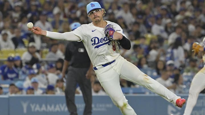 Jul 4, 2025; Los Angeles, California, USA; Los Angeles Dodgers third baseman Enrique Hernandez (8) throws Houston Astros left fielder Shay Whitcomb (10) out at first in the eighth inning at Dodger Stadium. Mandatory Credit: Jayne Kamin-Oncea-Imagn Images