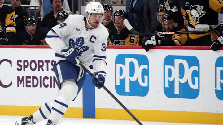 Dec 7, 2024; Pittsburgh, Pennsylvania, USA;  Toronto Maple Leafs center Auston Matthews (34) skates up ice with the puck against the Pittsburgh Penguins during the first period at PPG Paints Arena. Mandatory Credit: Charles LeClaire-Imagn Images