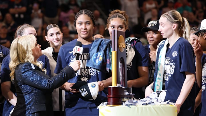 Apr 6, 2025; Tampa, FL, USA; ESPN reporter Holly Rowe interviews Connecticut Huskies forward Sarah Strong (21) after the national championship of the women's 2025 NCAA tournament against the South Carolina Gamecocks at Amalie Arena. Mandatory Credit: Nathan Ray Seebeck-Imagn Images