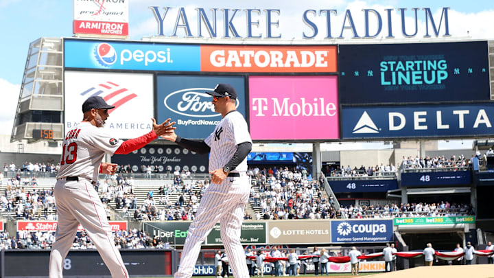 Red Sox manager Alex Cora and Yankee manager Aaron Boone shake hands prior to start of opening day game at Yankee Stadium April 8, 2022.

Yankees Opening Day