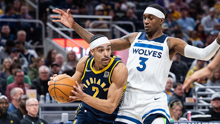 Mar 24, 2025; Indianapolis, Indiana, USA; Indiana Pacers guard Andrew Nembhard (2) dribbles the ball while Minnesota Timberwolves forward Jaden McDaniels (3) defends in the second half at Gainbridge Fieldhouse. Mandatory Credit: Trevor Ruszkowski-Imagn Images Mar 24, 2025; Indianapolis, Indiana, USA; Indiana Pacers guard Andrew Nembhard (2) dribbles the ball while Minnesota Timberwolves forward Jaden McDaniels (3) defends in the second half at Gainbridge Fieldhouse. Mandatory Credit: Trevor Ruszkowski-Imagn Images