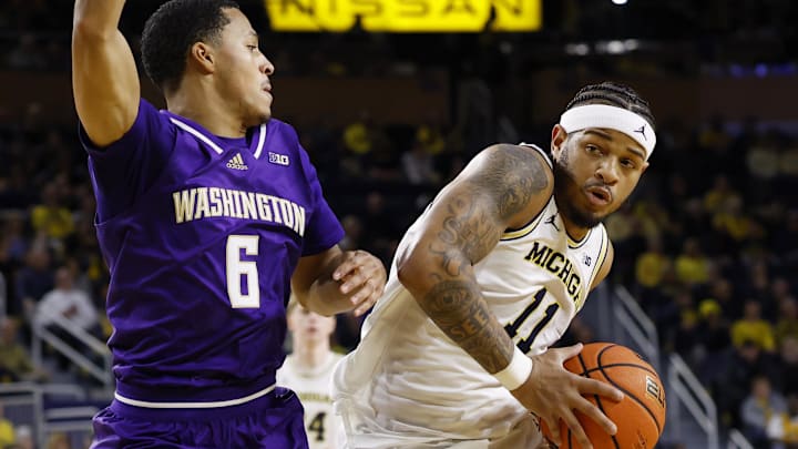 Michigan guard Roddy Gayle Jr. is defended by Washington  guard Tyree Ihenacho in the first half at Crisler Center. 