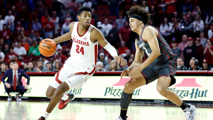 Alabama forward Brandon Miller (24) dribbles around Oklahoma forward Jalen Hill (1) during the first half of an NCAA college basketball game Saturday, Jan. 28, 2023, in Norman, Okla.
Ap23028700648550 Alabama forward Brandon Miller (24) dribbles around Oklahoma forward Jalen Hill (1) during the first half of an NCAA college basketball game Saturday, Jan. 28, 2023, in Norman, Okla.
Ap23028700648550