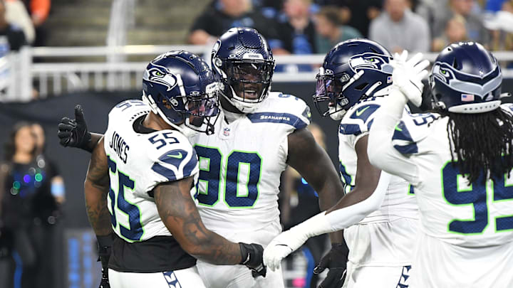Sep 30, 2024; Detroit, Michigan, USA; Seattle Seahawks defensive tackle Jarran Reed (90) celebrates with teammates after recording a sack against the Detroit Lions in the first quarter at Ford Field. Mandatory Credit: Eamon Horwedel-Imagn Images Sep 30, 2024; Detroit, Michigan, USA; Seattle Seahawks defensive tackle Jarran Reed (90) celebrates with teammates after recording a sack against the Detroit Lions in the first quarter at Ford Field. Mandatory Credit: Eamon Horwedel-Imagn Images