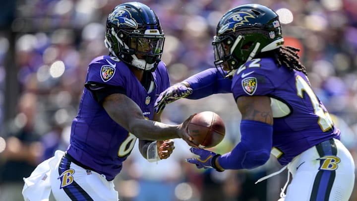 Sep 15, 2024; Baltimore, Maryland, USA; Baltimore Ravens quarterback Lamar Jackson (8) hands off to running back Derrick Henry (22) during the first half against the Las Vegas Raiders at M&T Bank Stadium. Sep 15, 2024; Baltimore, Maryland, USA; Baltimore Ravens quarterback Lamar Jackson (8) hands off to running back Derrick Henry (22) during the first half against the Las Vegas Raiders at M&T Bank Stadium.