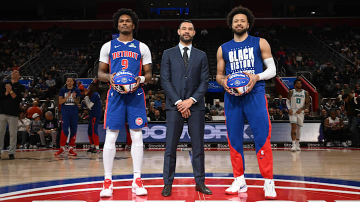 Detroit Pistons forward Thompson and Detroit Pistons guard Cunningham stand at center court with Detroit Pistons President of Basketball Operations Langdon to be recognized for being named to the NBA All-Star Team before their game against the Charlotte Hornets at Little Caesars Arena. 