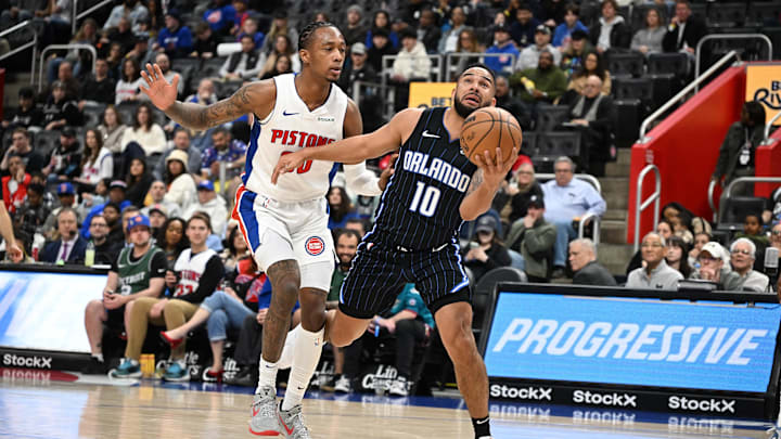 Orlando Magic guard Cory Joseph (10) drives past Detroit Pistons forward Ronald Holland II (00) in the second quarter at Little Caesars Arena.