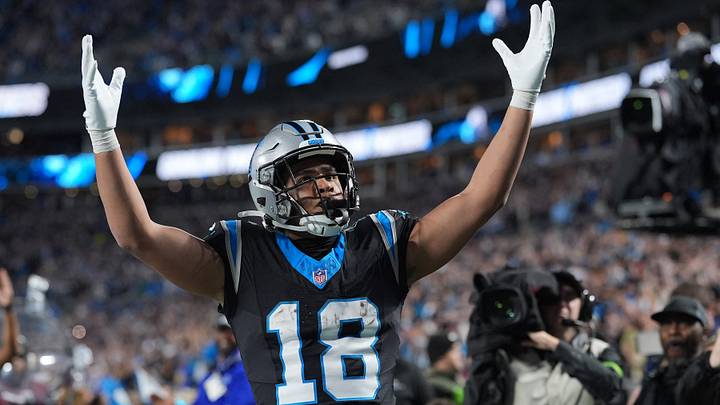 Jan 10, 2026; Charlotte, NC, USA; Carolina Panthers wide receiver Jalen Coker (18) reacts after making a touchdown against the Los Angeles Rams in the second half during the NFC Wild Card Round game at Bank of America Stadium. Jan 10, 2026; Charlotte, NC, USA; Carolina Panthers wide receiver Jalen Coker (18) reacts after making a touchdown against the Los Angeles Rams in the second half during the NFC Wild Card Round game at Bank of America Stadium.