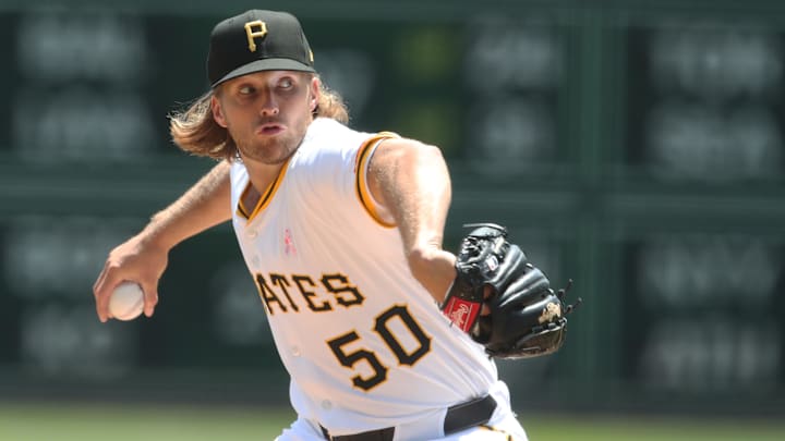 May 11, 2025; Pittsburgh, Pennsylvania, USA;  Pittsburgh Pirates starting pitcher Carmen Mlodzinski (50) delivers a pitch against the Atlanta Braves during the first inning at PNC Park. Mandatory Credit: Charles LeClaire-Imagn Images