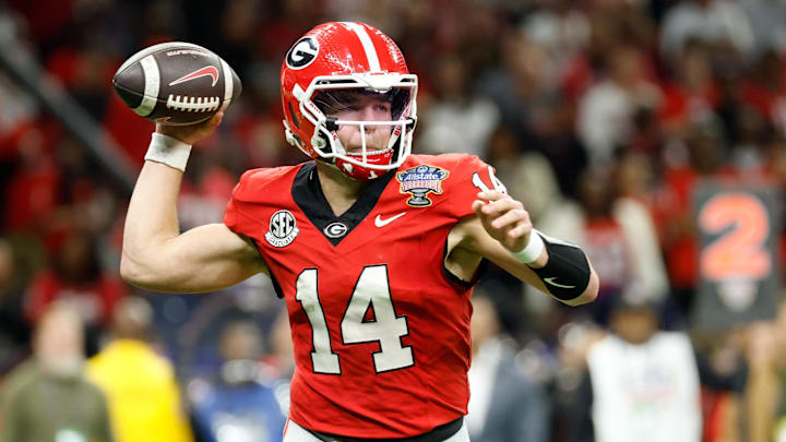 Jan 1, 2026; New Orleans, LA, USA; Georgia Bulldogs quarterback Gunner Stockton (14) passes the ball against the Mississippi Rebels in the second quarter during the 2026 Sugar Bowl and quarterfinal game of the College Football Playoff at Caesars Superdome. Mandatory Credit: Amber Searls-Imagn Images