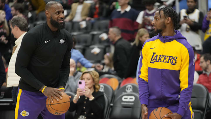 Los Angeles Lakers forward LeBron James and guard Bronny James during warm up before a game against the Toronto Raptors.