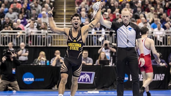 Mar 22, 2024; Kansas City, MO, USA; Richard Figueroa of Arizona State celebrates his victory over Anthony Noto of Lock Haven during the semifinal of the Men’s Division I NCAA Wrestling Championships at T-Mobile Center. Mandatory Credit: Nick Tre. Smith-Imagn Images