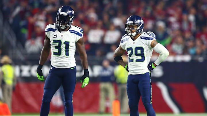 Dec 21, 2014; Glendale, AZ, USA; Seattle Seahawks safety Kam Chancellor (31) and safety Earl Thomas (29) against the Arizona Cardinals at University of Phoenix Stadium. The Seahawks defeated the Cardinals 35-6. Mandatory Credit: Mark J. Rebilas-Imagn Images