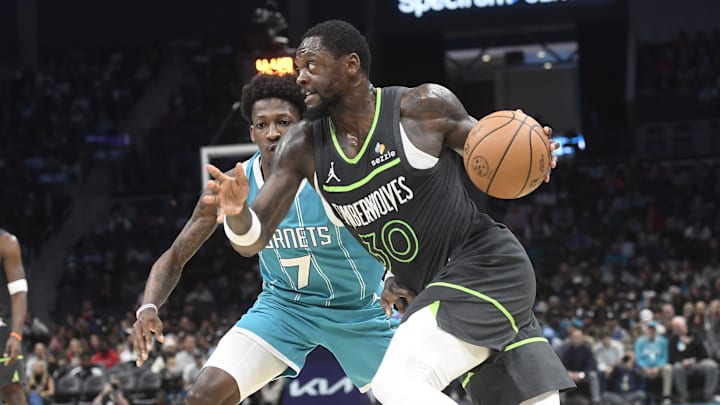 Minnesota Timberwolves forward Julius Randle dribbles past Charlotte Hornets guard Damion Baugh during the second half at the Spectrum Center in Charlotte, N.C., on March 5, 2025.