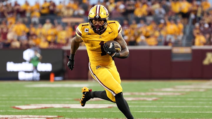 Aug 28, 2025; Minneapolis, Minnesota, USA; Minnesota Golden Gophers running back Darius Taylor (1) runs the ball against the Buffalo Bulls during the first half of the game at Huntington Bank Stadium.