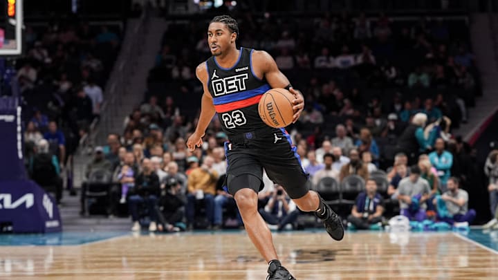Nov 6, 2024; Charlotte, North Carolina, USA; Detroit Pistons guard Jaden Ivey (23) handles the ball against the Charlotte Hornets during the first quarter at Spectrum Center. Mandatory Credit: Jim Dedmon-Imagn Images
