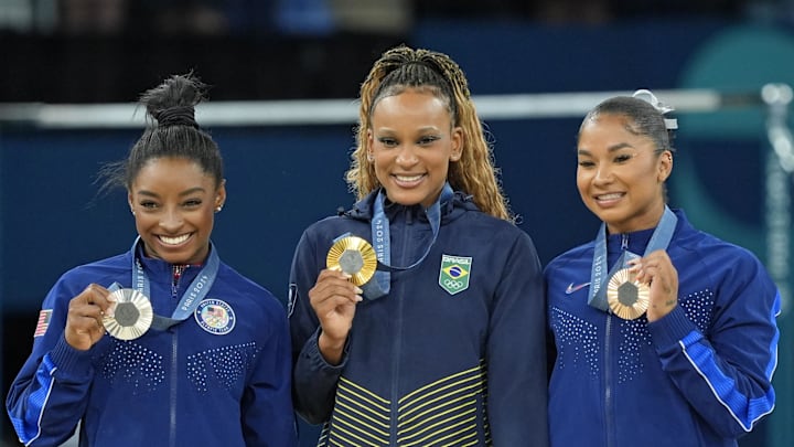Aug 5, 2024; Paris, France; Simone Biles of the United States, Rebeca Andrade of Brazil, and Jordan Chiles of the United States with their medals on the floor exercise on day three of the gymnastics event finals during the Paris 2024 Olympic Summer Games. Aug 5, 2024; Paris, France; Simone Biles of the United States, Rebeca Andrade of Brazil, and Jordan Chiles of the United States with their medals on the floor exercise on day three of the gymnastics event finals during the Paris 2024 Olympic Summer Games.