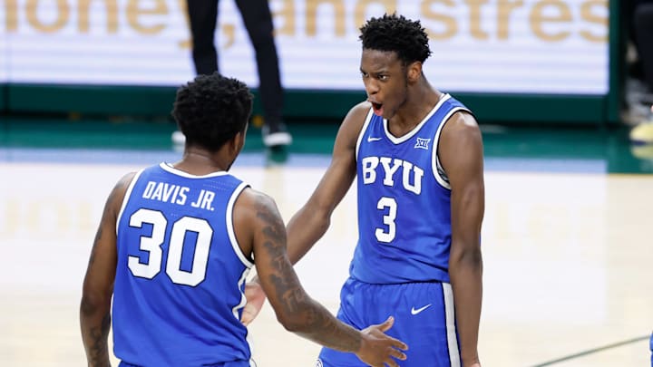 Feb 10, 2026; Waco, Texas, USA;  BYU Cougars forward AJ Dybantsa (3) reacts with guard Kennard Davis Jr. (30) after a play against the Baylor Bears during the second half at Paul and Alejandra Foster Pavilion. Mandatory Credit: Chris Jones-Imagn Images