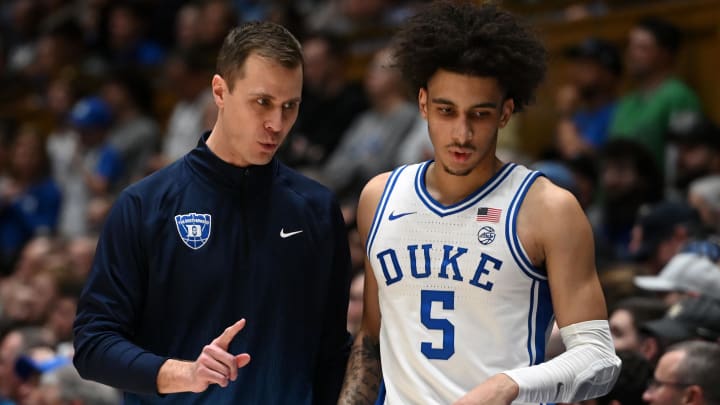 Duke basketball head coach Jon Scheyer and guard Tyrese Proctor Duke basketball head coach Jon Scheyer and guard Tyrese Proctor