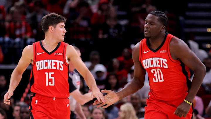 Oct 27, 2025; Houston, Texas, USA; Houston Rockets guard Reed Sheppard (15) congratulates Houston Rockets center Clint Capela (30) after a made basket against the Brooklyn Nets during the fourth quarter at Toyota Center. Mandatory Credit: Erik Williams-Imagn Images
