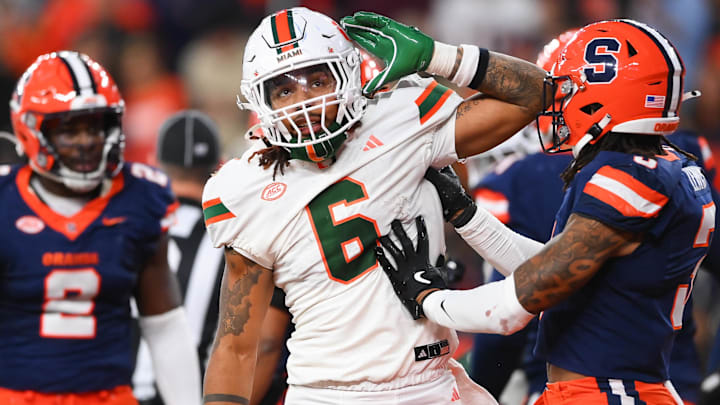 Nov 30, 2024; Syracuse, New York, USA; Miami Hurricanes running back Damien Martinez (6) gestures to fans after running for a touchdown against the Syracuse Orange during the second half at the JMA Wireless Dome. Mandatory Credit: Rich Barnes-Imagn Images