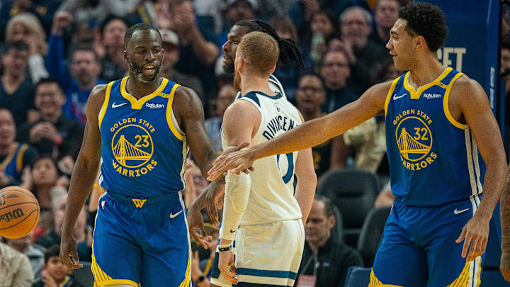 Dec 6, 2024; San Francisco, California, USA; Golden State Warriors forward Draymond Green (23) celebrates with  forward Trayce Jackson-Davis (32) after the basket against the Minnesota Timberwolves during the first quarter at Chase Center. Mandatory Credit: Neville E. Guard-Imagn Images