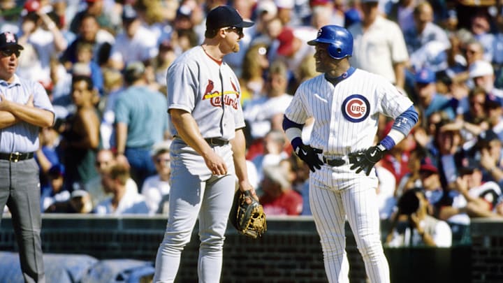 Aug 19, 1998; Chicago, IL, USA: FILE PHOTO; St. Louis Cardinals infielder Mark McGwire (left) talks to Chicago Cubs outfielder Sammy Sosa (right) at Wrigley Field. Mandatory Credit: Imagn Images