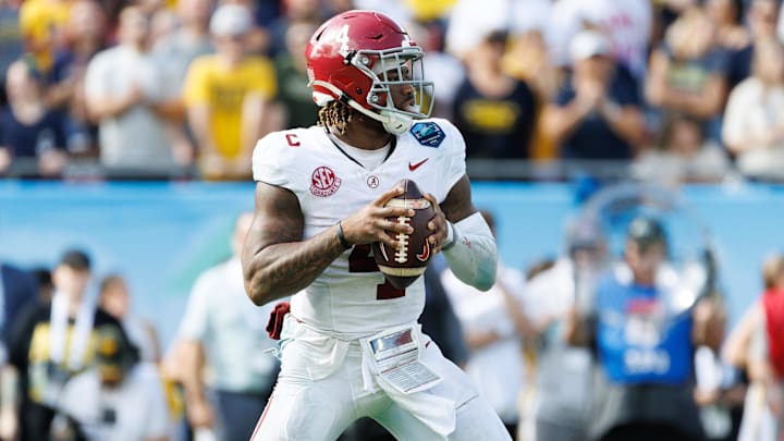 Dec 31, 2024; Tampa, FL, USA; Alabama Crimson Tide quarterback Jalen Milroe (4) looks to throw against the Michigan Wolverines during the second half at Raymond James Stadium. Mandatory Credit: Matt Pendleton-Imagn Images