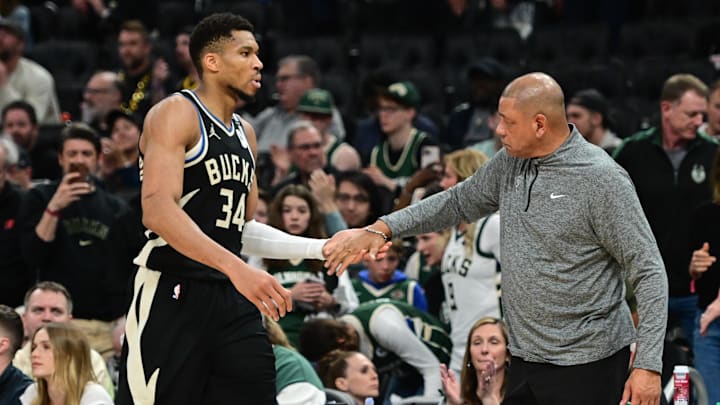 Apr 27, 2025; Milwaukee, Wisconsin, USA; Milwaukee Bucks forward Giannis Antetokounmpo (34) exits the game in the fourth quarter as head coach Doc Rivers shakes his hand during game four against the Indiana Pacers of first round for the 2024 NBA Playoffs at Fiserv Forum. Mandatory Credit: Benny Sieu-Imagn Images