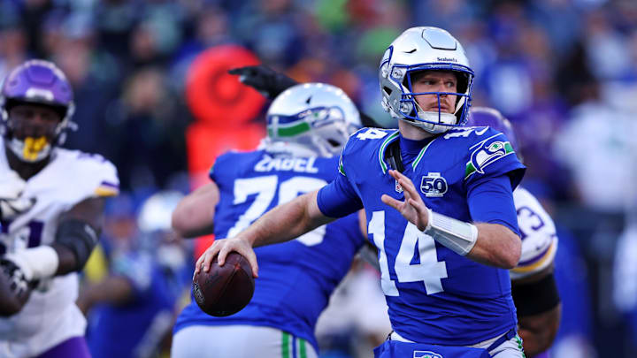 Nov 30, 2025; Seattle, Washington, USA; Seattle Seahawks quarterback Sam Darnold (14) drops back to make a pass during the second half against the Minnesota Vikings at Lumen Field. Mandatory Credit: Kevin Ng-Imagn Images