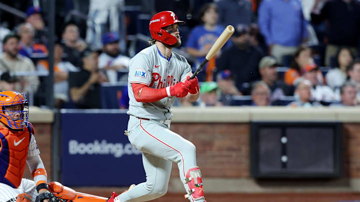 Oct 8, 2024; New York City, New York, USA; Philadelphia Phillies first baseman Bryce Harper (3) hits an RBI single in the eighth inning against the New York Mets during game three of the NLDS for the 2024 MLB Playoffs at Citi Field. Oct 8, 2024; New York City, New York, USA; Philadelphia Phillies first baseman Bryce Harper (3) hits an RBI single in the eighth inning against the New York Mets during game three of the NLDS for the 2024 MLB Playoffs at Citi Field.