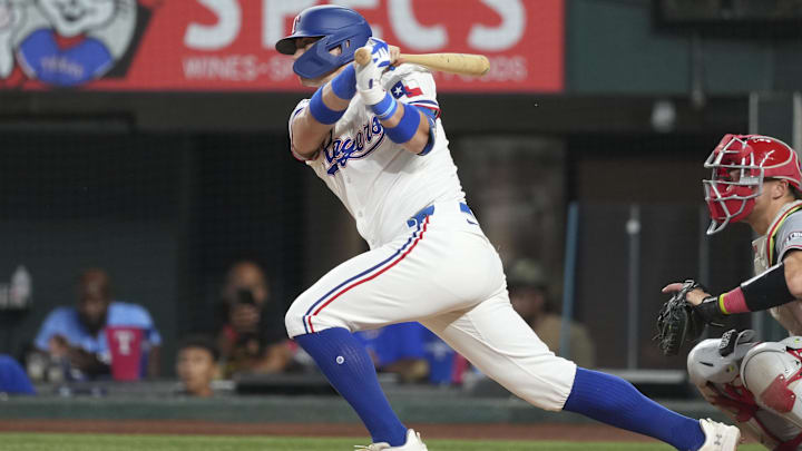 Sep 7, 2024; Arlington, Texas, USA; Texas Rangers third baseman Josh Jung (6) follows through on his single against the Los Angeles Angels during the sixth inning at Globe Life Field.