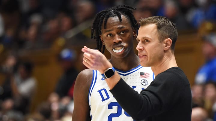 Jan 11, 2023; Durham, North Carolina, USA; Duke Blue Devils head coach Jon Scheyer instructs forward Mark Mitchell (25) during the second half against the Pittsburgh Panthers at Cameron Indoor Stadium. Mandatory Credit: Rob Kinnan-Imagn Images