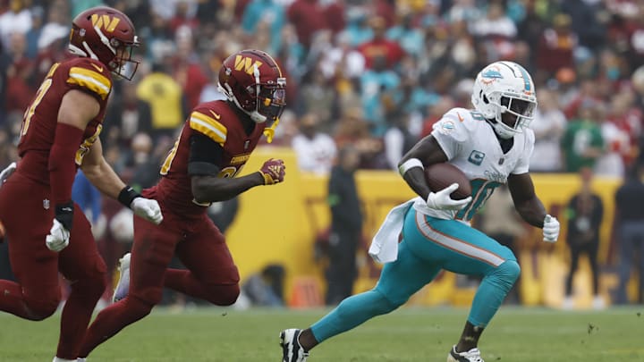 Dec 3, 2023; Landover, Maryland, USA; Miami Dolphins wide receiver Tyreek Hill (10) runs with the